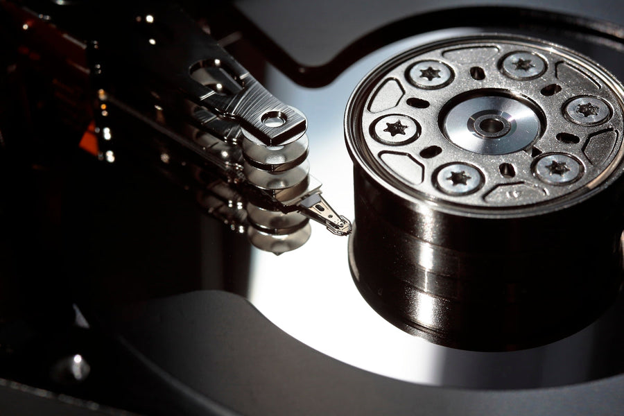 a close up of a hard drive with a guitar
